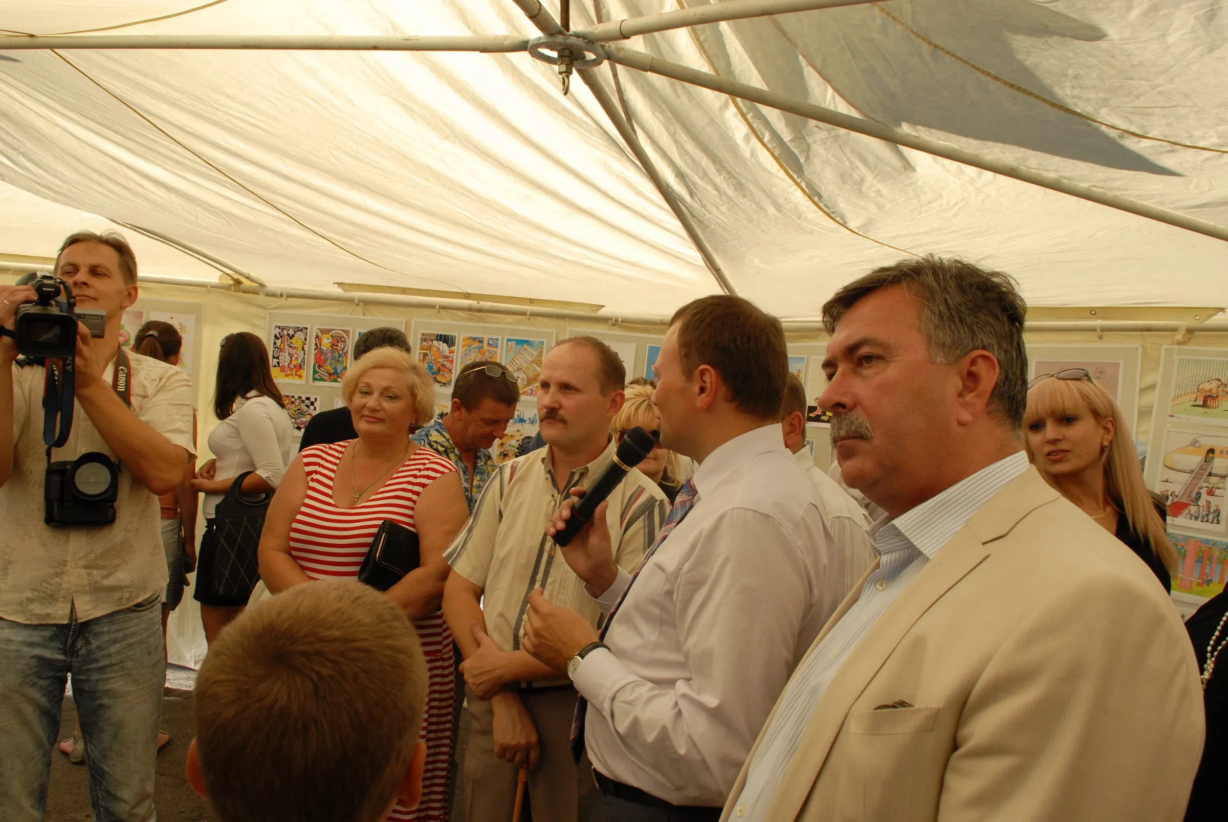 A crowd under a marquee at the international cartoon competition in Vasylivka